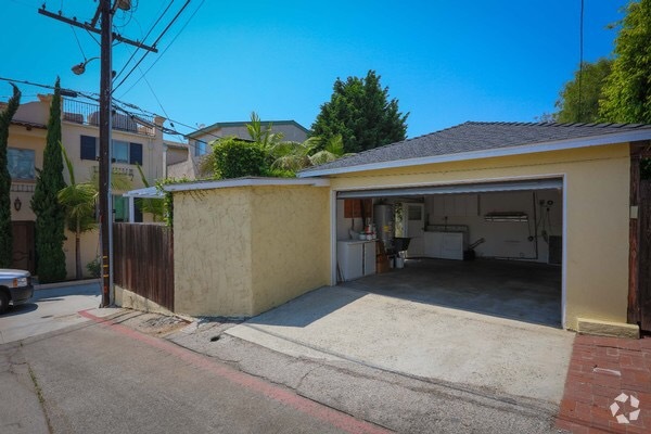 Garage door is on a remote control —washer and dryer within, door leading directly to back lawn - 826 21st St