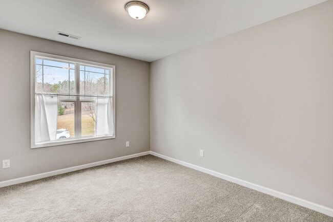 Building Photo - 4 Bedroom Townhouse for Rent in Clayton NC | Garage | Pet Friendly | Wooded View! | MOVE IN SPECI...