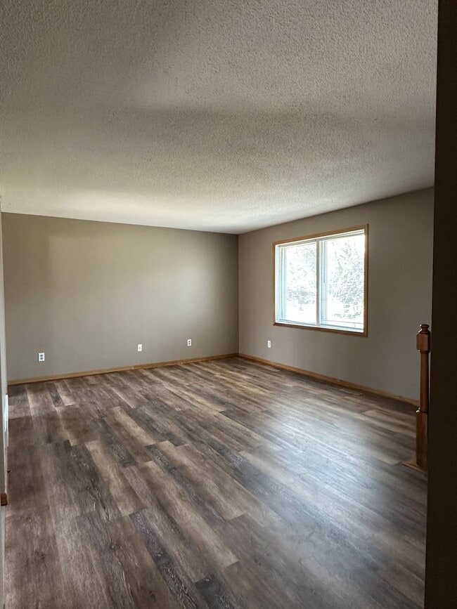 Building Photo - NE House for Rent 4 bedroom 2 full bathroom fenced in yard 2 Car attached garage.