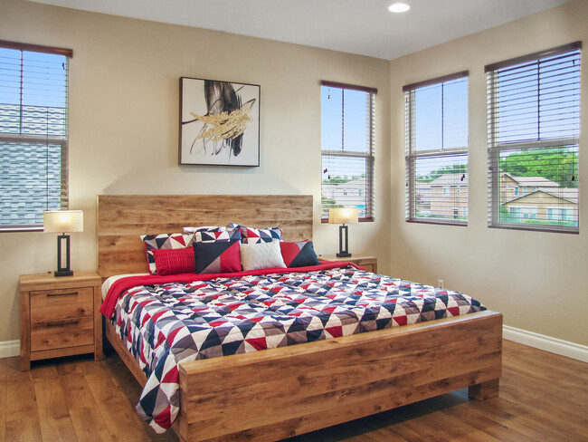 2nd floor: The master bedroom boasts a king-sized bed, an ensuite private bathroom w/ a double sink - 11013 Ragsdale Rd