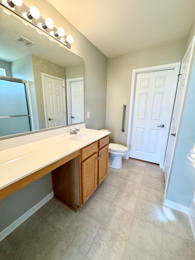 Building Photo - Like New 3 Bedroom & 2 Bath pond front home in Hillsborough! Enjoy the Community Pool, Playground...