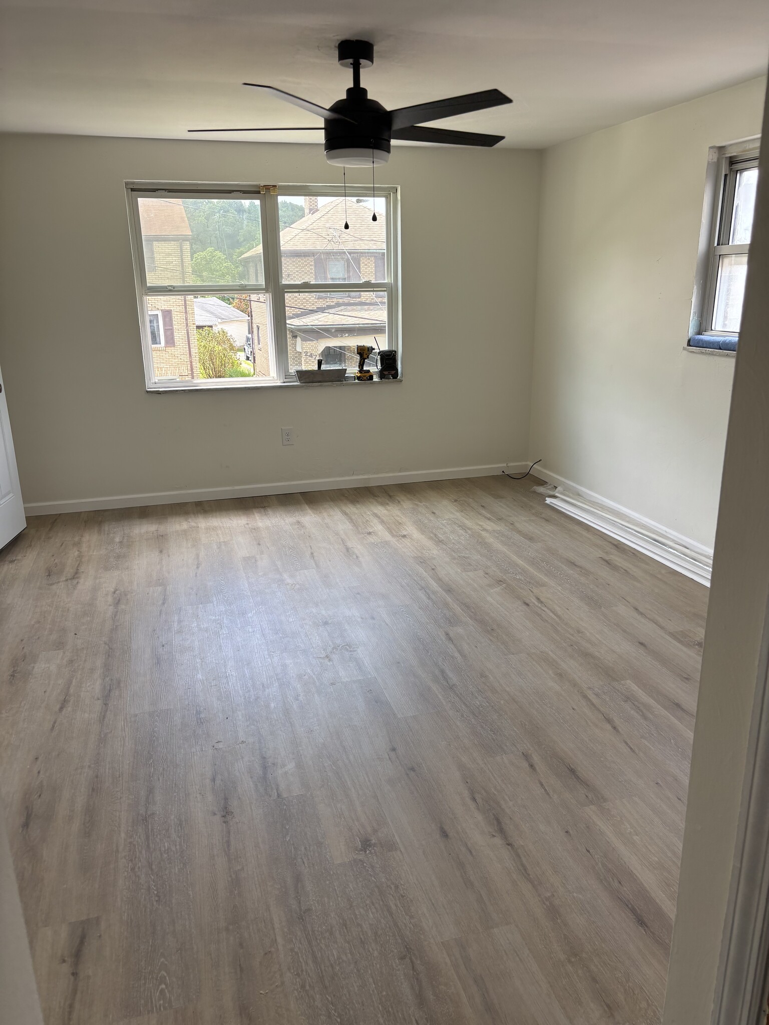 Living room with new LVT flooring - 244 Clairmont Ave