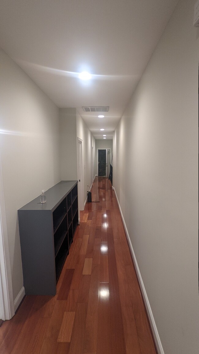 Hallway with bookshelves - 52 New York Ave NW