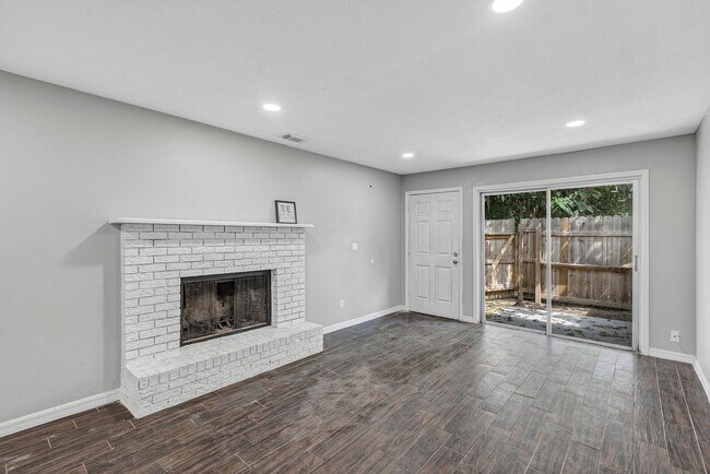 Building Photo - Spacious 3BR/2BA Ocala Home with Modern Finishes,Fireplace Floor-to-Ceiling Sliding Glass Doors &...