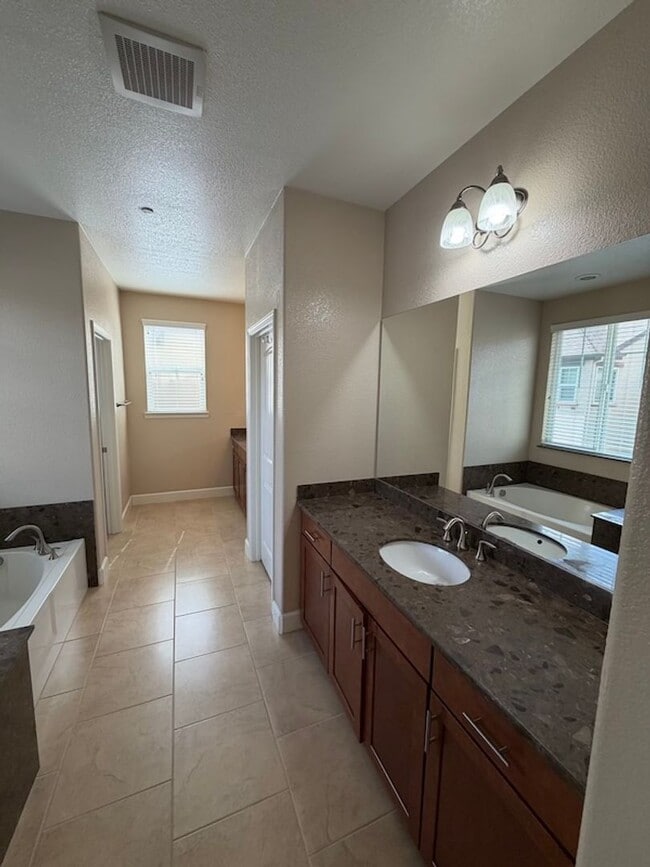 Building Photo - Solar Home with EV Garage Charging. 4 Bedroom Home with Downstairs Bedroom and Full Bathroom.
