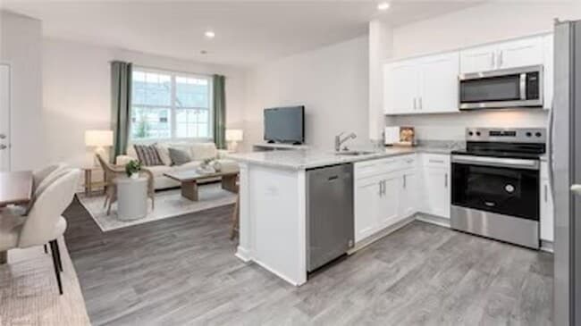 Building Photo - Modern 3-Bedroom Townhome with Garage in North Village Townes
