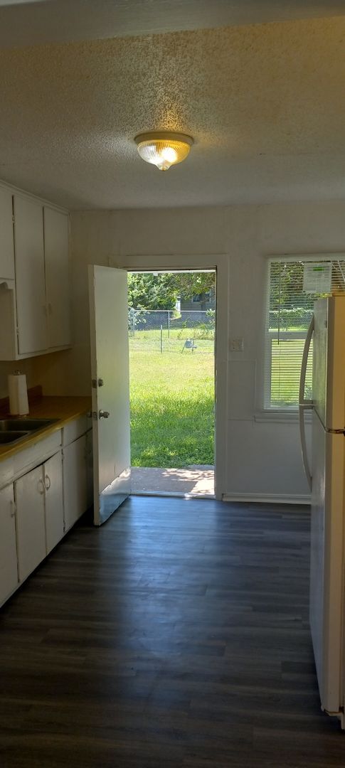 Building Photo - NEW listing-refinished hardwood floors, new laminate and paint throughout