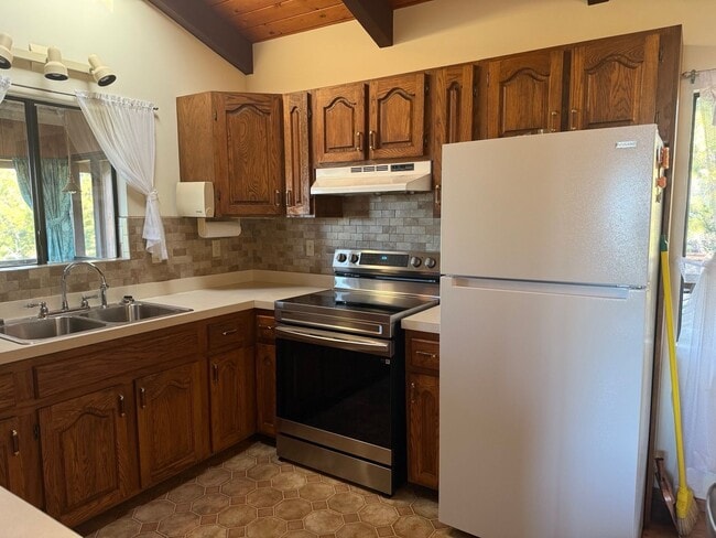Building Photo - Experience comfort in this charming 3 bed, 2 bath rental home with a wood-burning stove, sunken j...