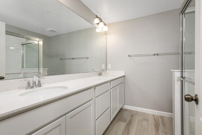 Master bath has double vanity with an extra large shower - 14799 Outfitter St