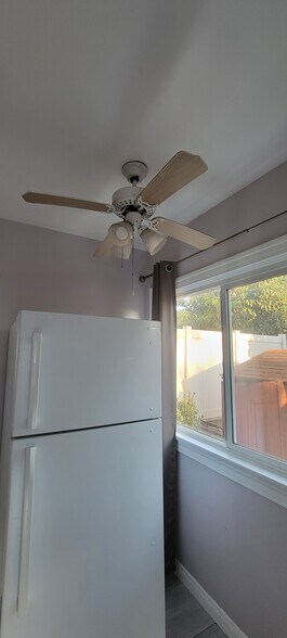 refrigerator and one of the three fans in the unit - 110 N San Marino Ave