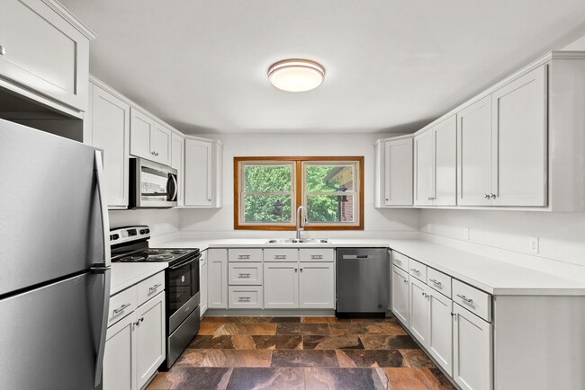 Building Photo - Large 4-Bed Brick Rancher with 2-Car Attached Garage!