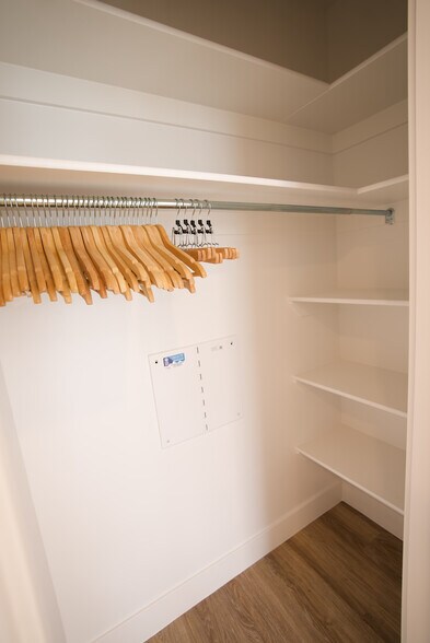 Primary bedroom large closet with shelves - 525 N 1st St