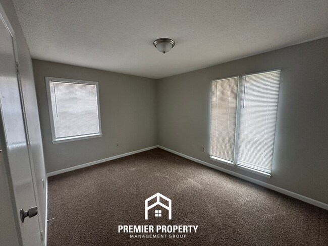 Building Photo - Charming 3BR Memphis Home | Rustic Brick Fireplace, Formal Dining & Fenced Backyard