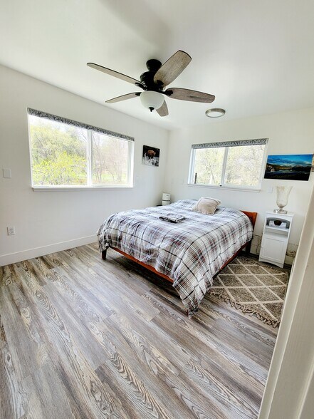 Bedroom with queen bed, and dresser - 10301 Wolf Dr