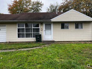 Building Photo - 3 BR 1.5 BA split-level with attached 1 ca...