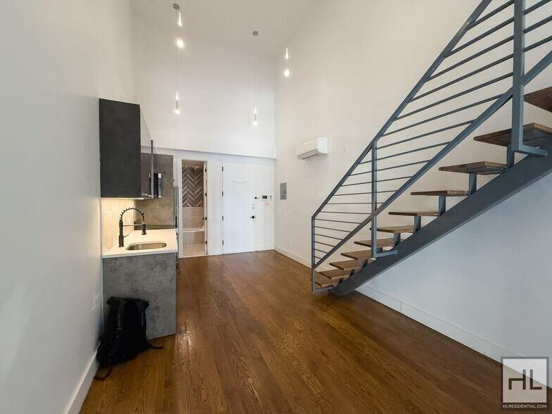 Primary Photo - Stunning Two-Bedroom Duplex with Soaring 1...