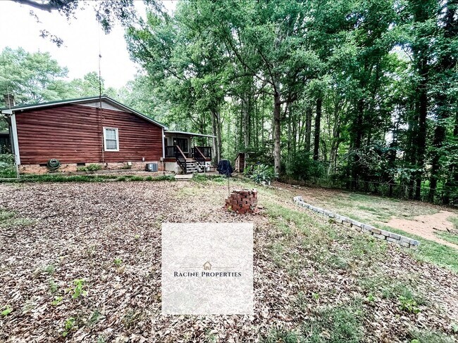 Building Photo - Your Wooded Oasis Awaits