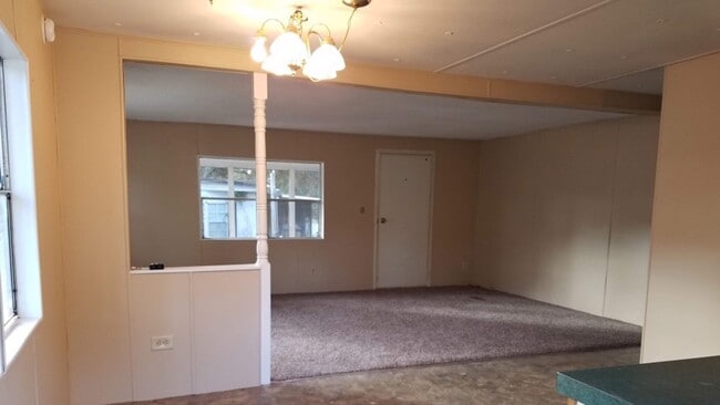 Building Photo - Freshly painted spacious 2-bedroom 1-bath home with a screened porch and storage shed.