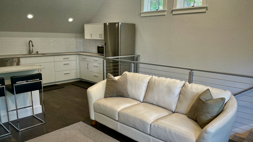 Close up of couch and kitchen - 297 Durham Point Rd