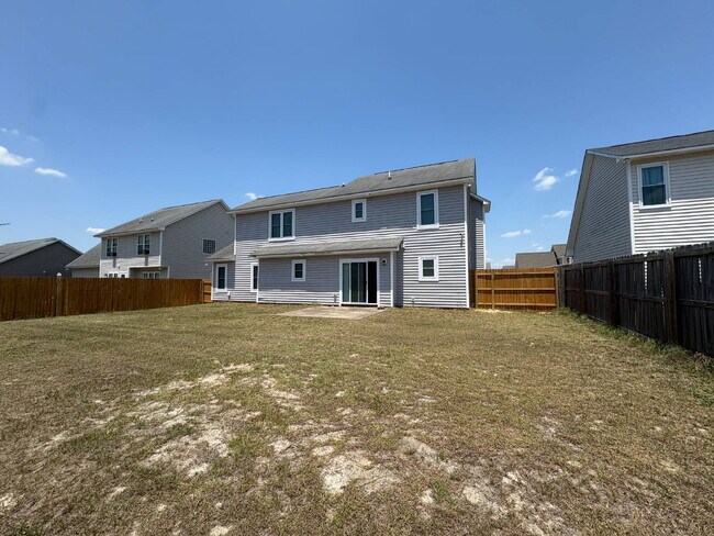 Building Photo - Spacious 4-Bedroom Sanctuary with Cozy Fireplace on Chimney Swift Drive!