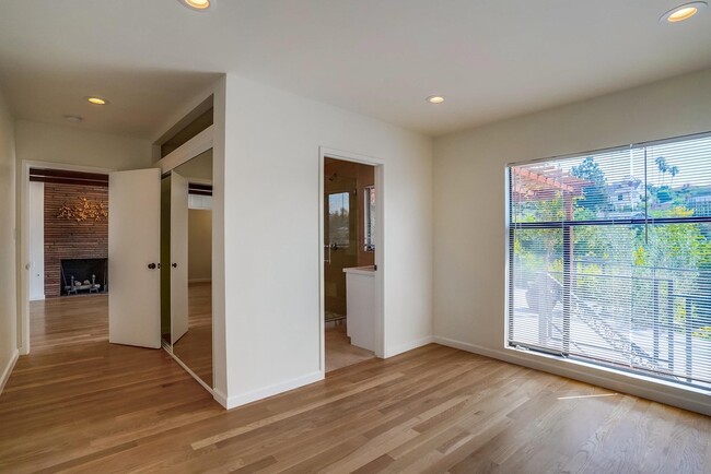 Rear Bedroom with hugh bright windows and view - 556 Luton Dr