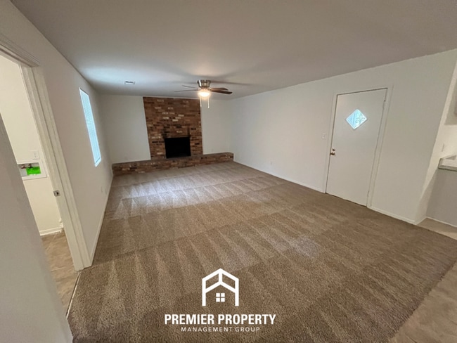 Building Photo - Spacious 3BR/2BA Home with Den & Living Room | Brick Fireplace & Large Yard