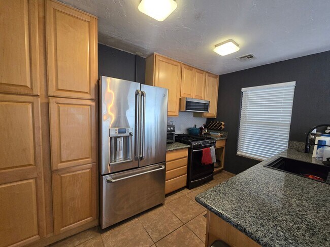 Building Photo - Furnished, 1-Year Long-Term Rental