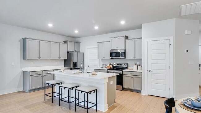 Building Photo - Coming Soon - BRAND NEW Welcome to the highly sought-after Nature's Walk on the Flint community i...