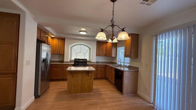 Building Photo - New flooring and freshly painted 4 bedroom home