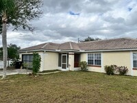 Building Photo - COZY 3 BEDROOM, 2 BATH HOME WITH TILE & LAMINATE THROUGHOUT, PRIVATE SCREENED PATIO