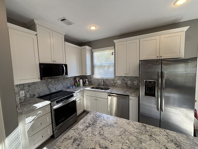 Building Photo - Gated Private Community! Spacious 3 Bedroo...