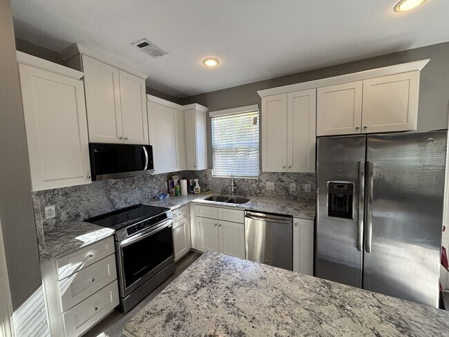 Building Photo - Gated Private Community! Spacious 3 Bedroom and 2.5 Bath End Unit Townhome