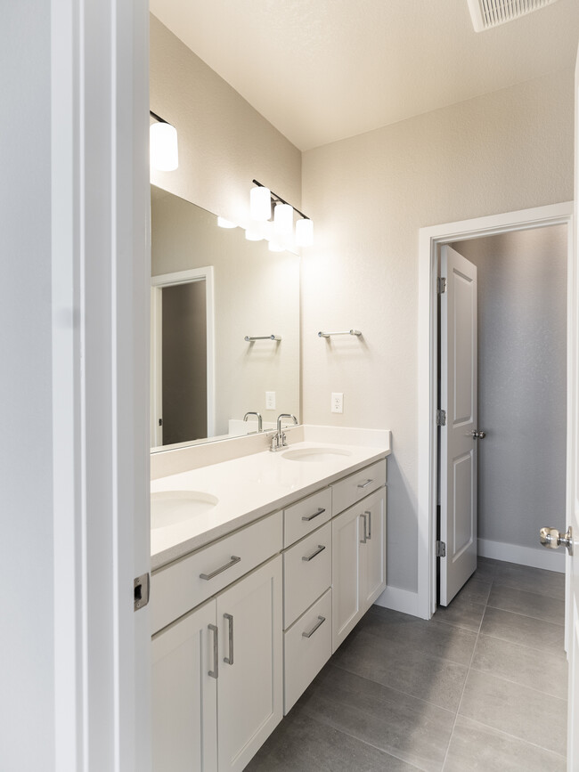 Full bath with double-vanity, high countertop - 2863 W 69th Ave