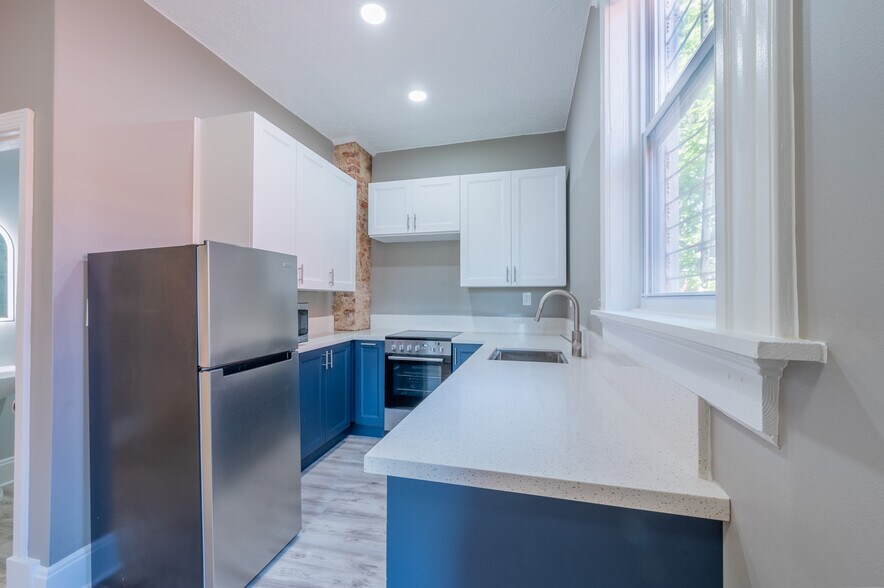 Kitchen with brand new stainless appliances including dish washer and Quartz countertops! - 304 Warner St