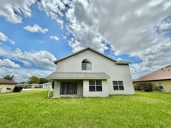 Building Photo - LARGE AND SPACIOUS 4/3 HOME IN EAST ORLANDO WEDGEFIED COMMUNITY