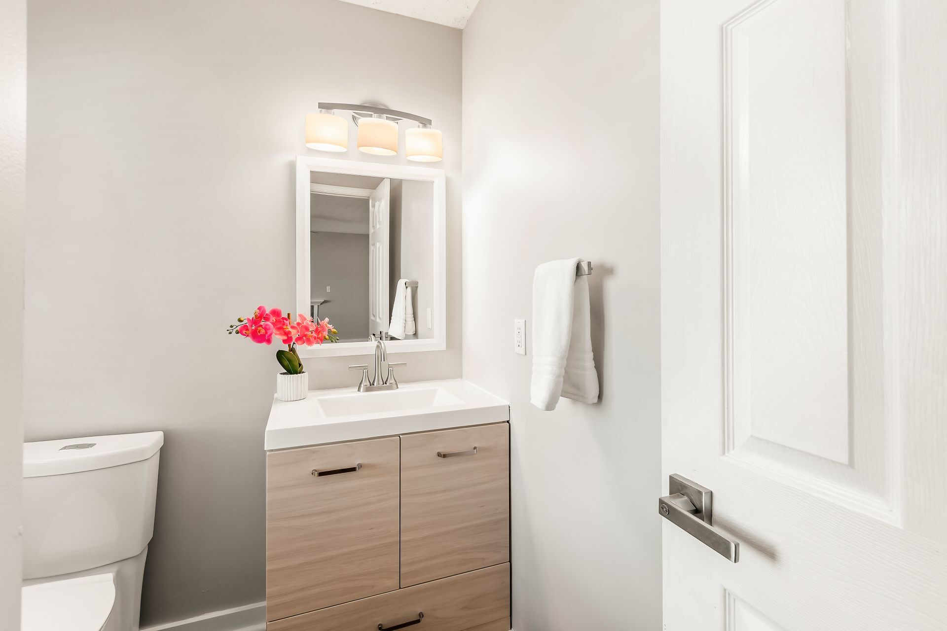Powder room with new vanity, light fixture, mirror - 135 Hancock St