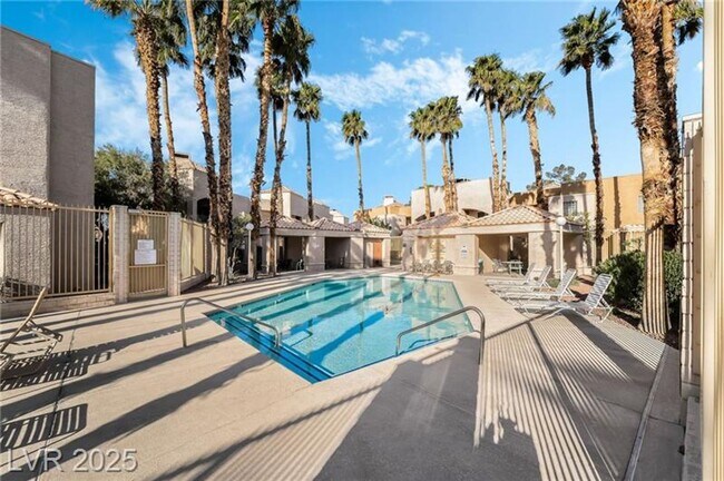 Building Photo - INVITING 2 BEDROOM TOP FLOOR CONDO IN A CE...