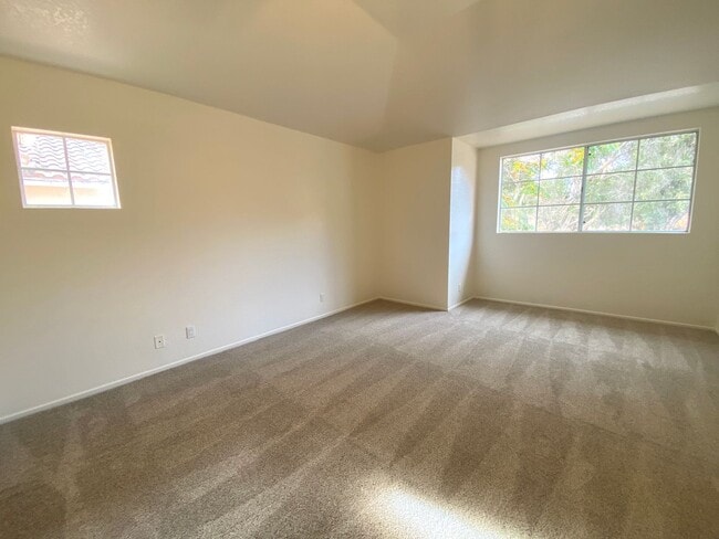 Building Photo - NEW PRICE! Spacious 3bdrm 2.5bath Condo w/2 car garage & private laundry hookups, community Pool ...