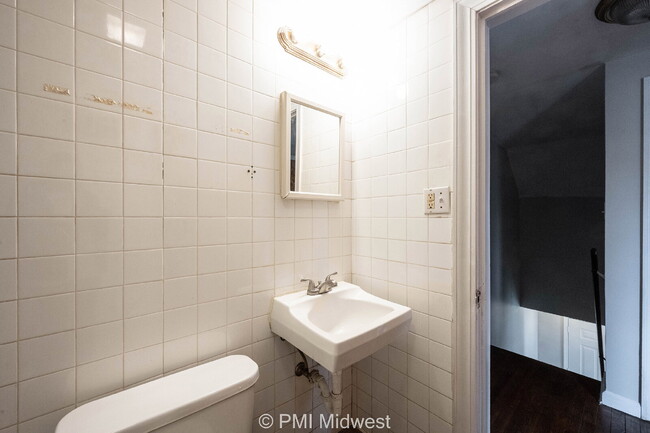 Building Photo - "Charming 2-Bedroom Duplex with Gleaming H...