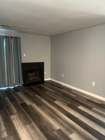 Living room with wood-burning fireplace - 5384 Bedford Ter