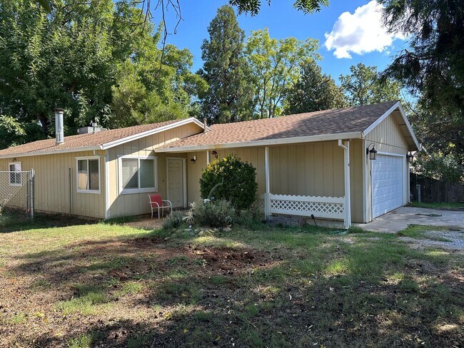Building Photo - Charming Redding Home with Fireplace & Vau...