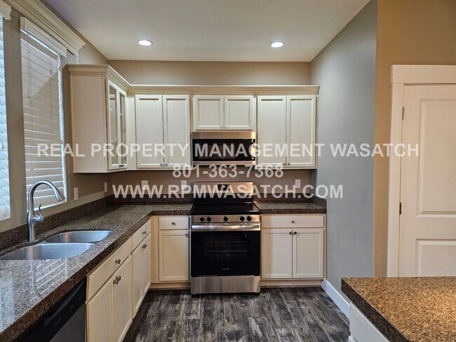 Building Photo - 4 Bedroom 2.5 Bath Town Home in Daybreak! MOVE IN SPECIAL 1/2 Off 1st Months Rent