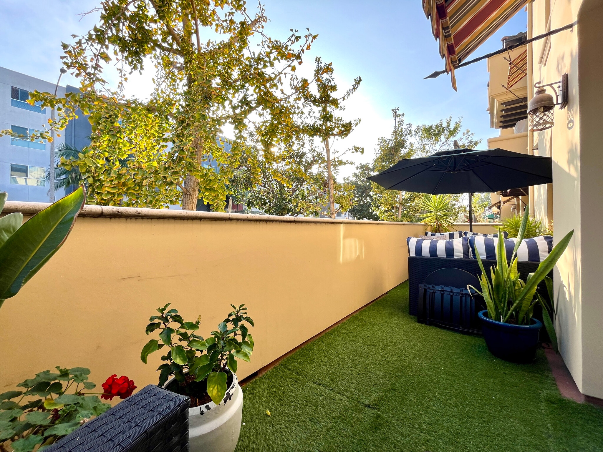 This patio is on the front of the building looking onto a quiet street. - 5037 Rosewood Ave