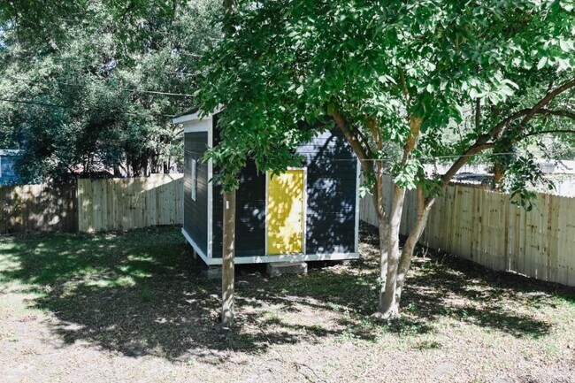 Large storage building in back yard with privacy fence. - 2429 Remount Rd