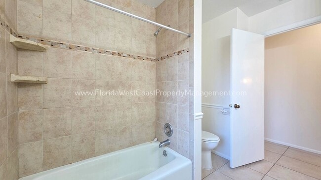 Building Photo - SPACIOUS SARASOTA HOME WITH LARGE FENCED YARD! MOVE IN READY! ALL TILE/ NEW LVP!