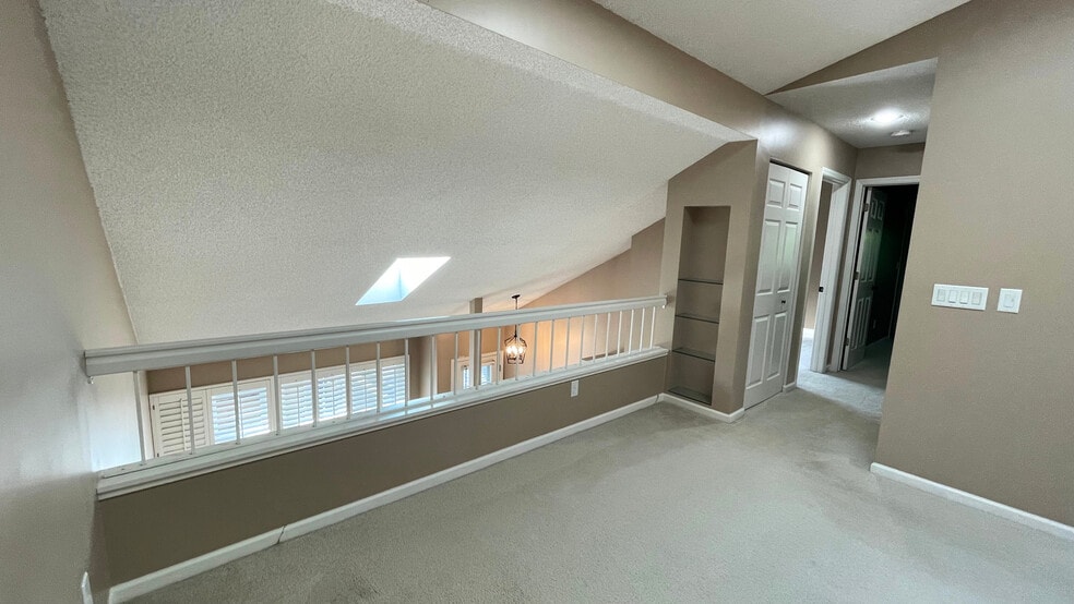 Loft area with a built in bookshelf. - 15805 24th Ave N.