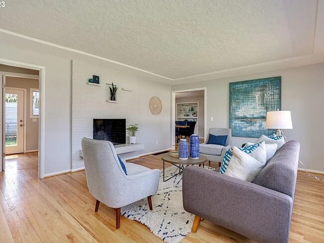 Building Photo - Stylishly Updated Mid-Century Gem on a Qui...