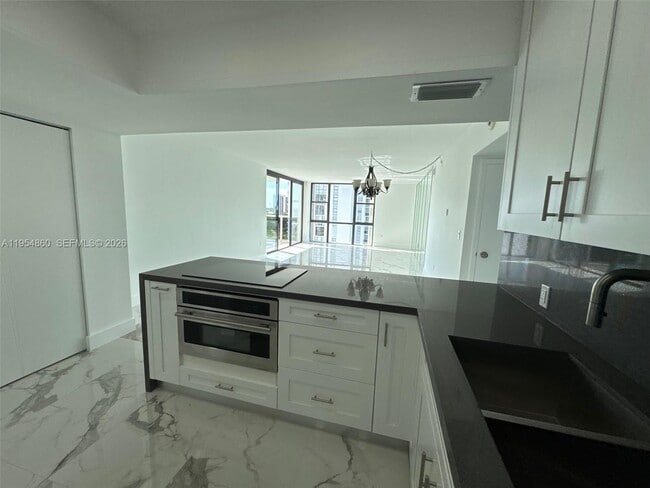 Building Photo - 3675 N Country Club Dr