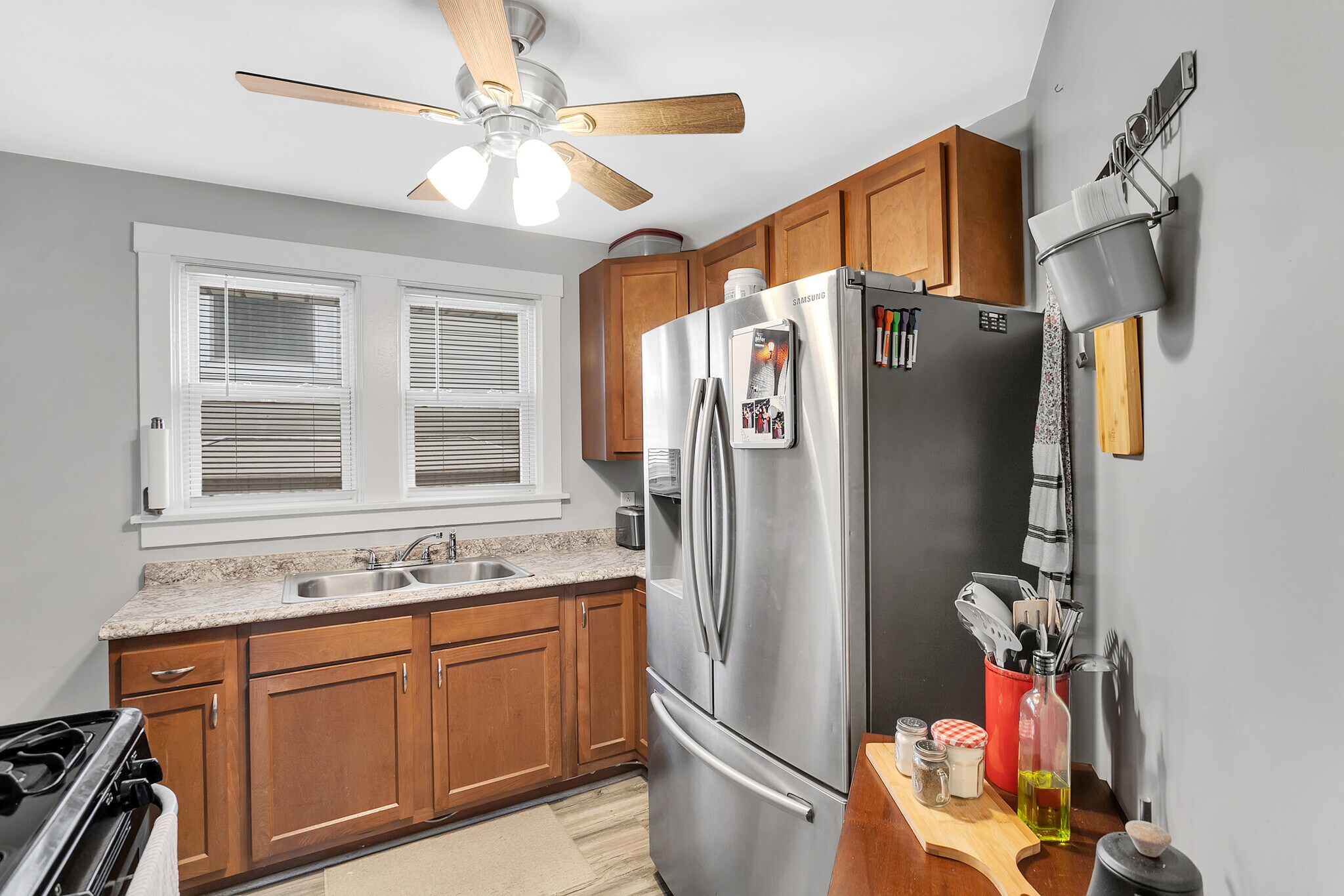 Updated kitchen with stainless steel appliances and ample cabinet space. - 203 Richbarn