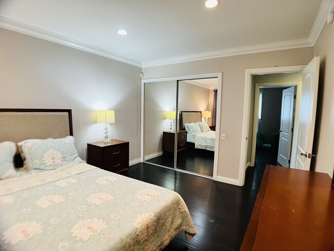 Master Bedroom with wall-length closet - 6301 Coldwater Canyon Ave